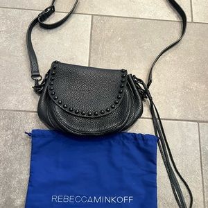 Black Rebecca Minkoff  crossbody purse with black hardware and grommets